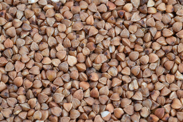 Fototapeta premium Culinary buckwheat groats ready for cooking and recipe development, closeup detail emphasizes texture and nutty character, inspires chefs and home cooks for creative dishes