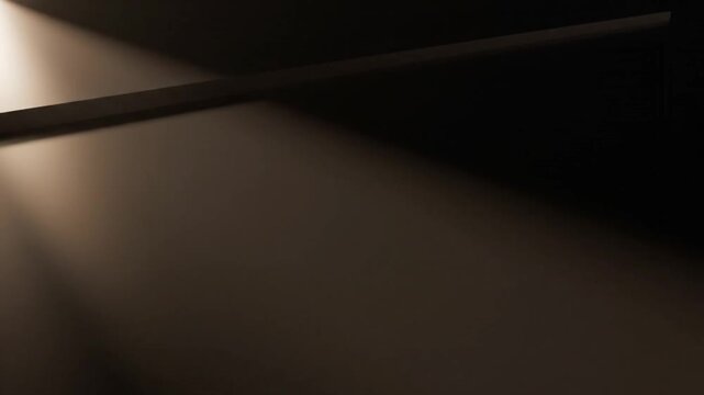 A dark room with a beam of light shining through a gap in the wall onto a floor with a dramatic and mysterious mood.