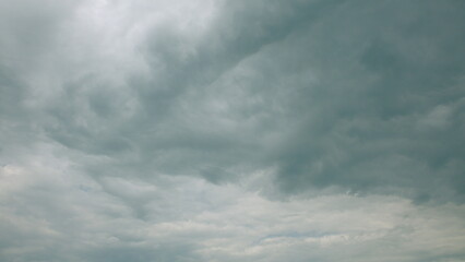 Fototapeta premium An Overcast Sky Filled with Dramatic and Intriguing Cloud Patterns Surrounding Us in Nature