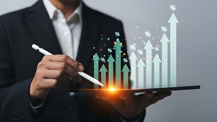 Business professional interacting with a digital tablet displaying glowing upward trending growth charts indicating rising financial success and percentage gains