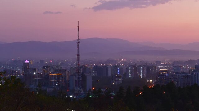 Timelapse scenic Tajikistan capital Dushanbe panorama from popular hilltop Victory park viewpoint with Tv tower, landmarks, buildings, real estate property development site