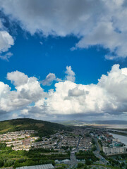 High Angle Drone Camera Footage of Swansea City Centre Near Coastal Beach During Sunny Day of July 14th, 2025. Swansea is Most Beautiful, Modern City and county on the south coast of Wales, UK