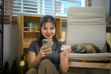 Happy woman credit card with e commerce and smartphone while online shopping