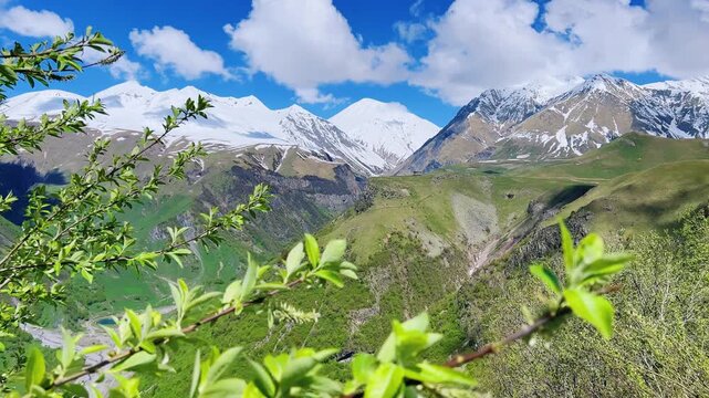 GUDAURI, GEORGIA - APRIL 26, 2024: Scenic view of the Devil's Gorge and the Arch of Friendship. The Caucasus Mountains in the area of the Peoples' Friendship Arch on the Georgian Military Road. 4K