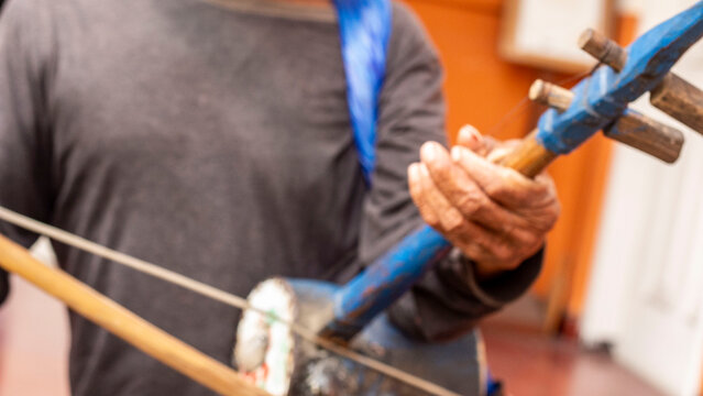 Oldman playing rebab music instrumental