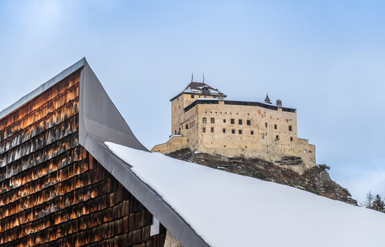 Historic Castle of Tarasp and Modern Building Contrast