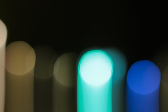 Abstract blurred colorful light streaks on dark background using slow shutter speed creating dynamic visual effect for creative designs