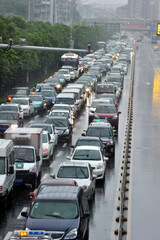 Heavy Traffic Congestion on Rainy City Main Road