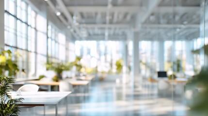 blurred office interior background empty light open space office with big windows many glasses walls desks chairs and green plants modern indoor business environment