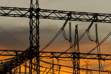High Voltage Power Lines Silhouette at Sunset, Electricity Infrastructure Concept