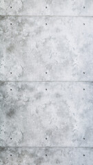 Vertical texture background of exposed concrete wall with tie holes and visible seams in industrial loft style.