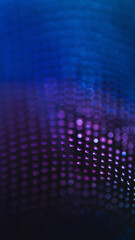 Vertical abstract background featuring deep blue and purple glowing bokeh lights with floating particles in a dark space.