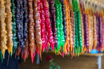 Traditional Georgian Churchkhela Sweets Hanging in a Row at a Market