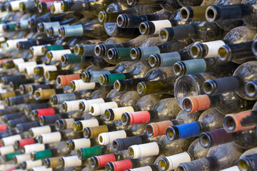 Rows of Dusty Empty Wine Bottles in a Dark Cellar or Warehouse