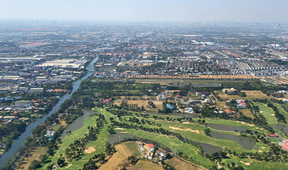 Fototapeta premium Aerial view of Bang Phli cityscape and Samrong River in Samut Prakan, Thailand, Southeast Asia.