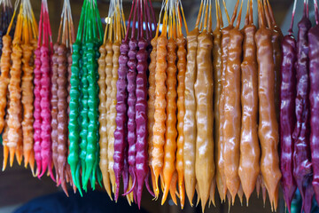 Traditional Georgian Churchkhela Sweets Hanging in a Row at a Market