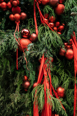 Festive Christmas Tree Decorated with Red Baubles and Ribbons