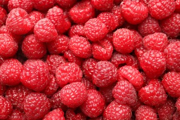 Fresh ripe raspberries as background, top view