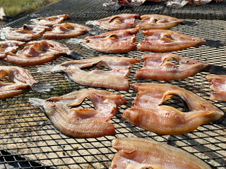 cooking fish in the open air on the grill in the village