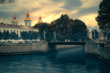 St. Petersburg Canals at Dusk: Golden Twilight of Church Spires and Waterfront Architecture