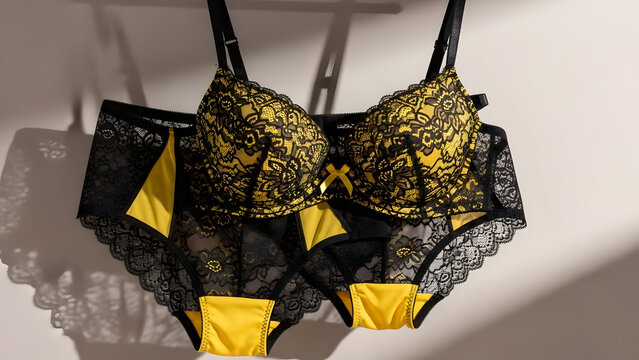 hanging black yellow lace sexy lingeri.flat lay.
