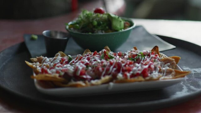 Nachos served on plate, shallow depth of field