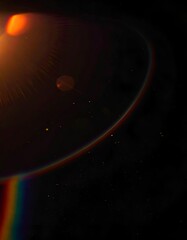 Lens flare creating an abstract composition of light and color on black