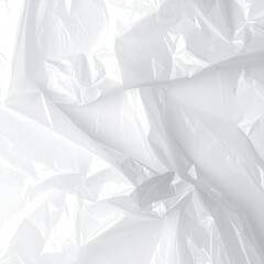 White crumpled plastic sheeting reflects light in an abstract pattern
