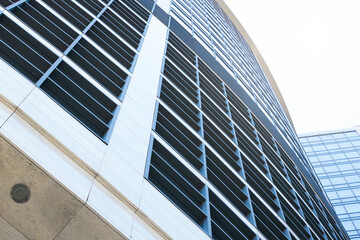 skyscraper facade frame foreshortening from below basic part of building glass external windows and concrete walls background geometric concept pattern