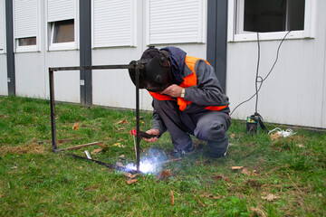 Construction Workers Welding Metal Pipes
