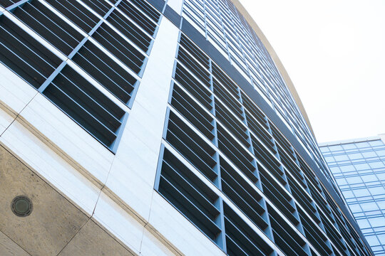 skyscraper facade frame foreshortening from below basic part of building glass external windows and concrete walls background geometric concept pattern - Powered by Adobe