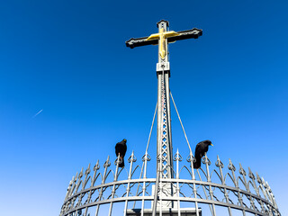 Chiemgau as a Bavarian Region with a beautiful summit cross peak view and a true hike destination 