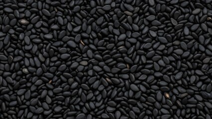 A close-up view of a large pile of black sesame seeds
