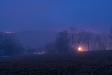 Winter blue hour after sunset with inversion fog near Cereniste village