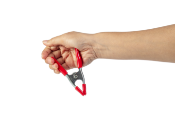 A studio shot of a red stainless spring clamp in hand isolated on a transparent background