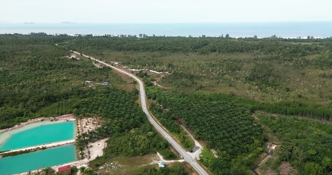 Aerial Drone Footage Of Pugu Fishing Village,Background Green Mount Gading Lundu And Open Sea With White Sandy Beach,That Connected To Sematan Town,Borneo,Malaysia