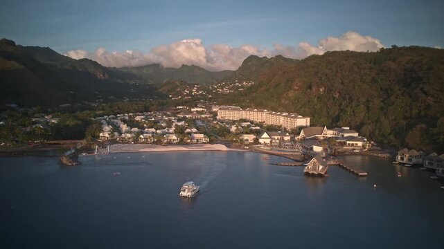 Drone hyperlapse semi orbit revealing Saint Vincent and the Grenadines coastline with tropical water and resort landscape.