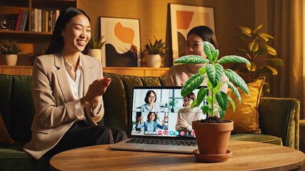 Smiling women engage in a virtual team meeting from a cozy home office, celebrating remote collaboration and fostering positive connections