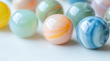 Obraz premium A collection of smooth colorful glass marbles with swirling patterns arranged closely together showcasing their shiny reflective surfaces