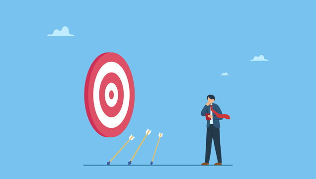 Businessman holding book look at missed target arrow learning or studying mistakes. Learn from failure or mistake, admit and embrace the failure and practice to achieve success next time.