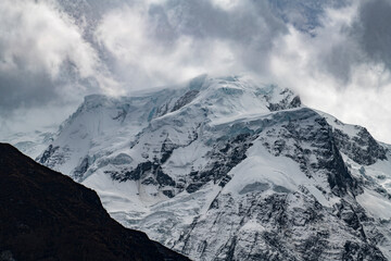 Gangapurna (7,455 meters) and the Gangapurna Glacier rising above the Manang Valley, photographed shortly before reaching Manang on the Annapurna Circuit in Nepal. Dramatic Himalayan mountain landscap