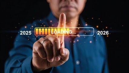 Man in blue shirt interacting with futuristic interface with loading bar from 2025 to 2026