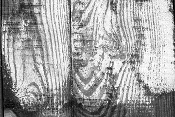 Wooden boards painted white. Black and white background.