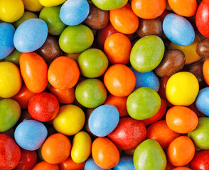 Colorful candy background with sugar coated treats