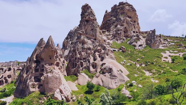 Goreme, Turkey, May 8, 2024: Uchhisar Fortress city. The famous Uchhisar Cave Castle in Cappadocia. The big stone town of Uchkhisar in hot summer weather. 4K
