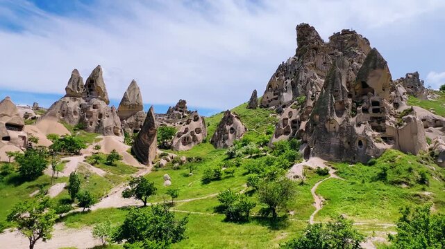 Goreme, Turkey, May 8, 2024: Uchhisar Fortress city. The famous Uchhisar Cave Castle in Cappadocia. The big stone town of Uchkhisar in hot summer weather. 4K