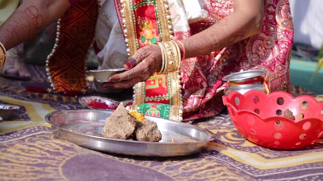 Authentic Indian marriage vidhi video showing traditional Hindu wedding rituals and sacred ceremonies. Features bride and groom performing wedding customs, Vedic rituals, priests, sacred fire (havan),