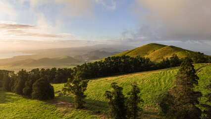 Sunset over green pastures, Azores islands, drone view. © Ayla Harbich