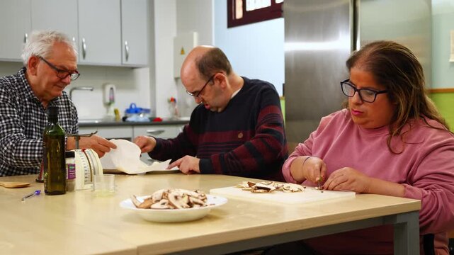 People with disabilities preparing food in a cooking class