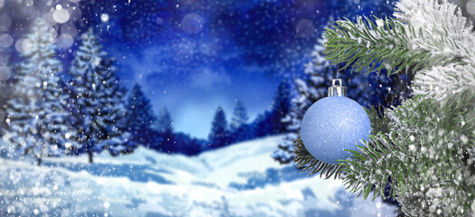 Christmas ball hanging from fir tree branch in snowy forest. Banner design